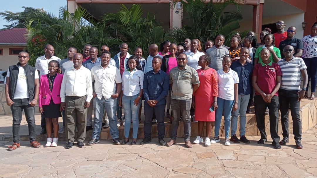 Makueni County staff and GGIL staff standing together for a group photograph outside a building