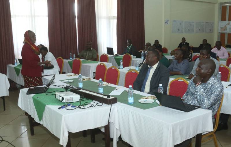 County executive members seated at tables following a presentation during a technical meeting