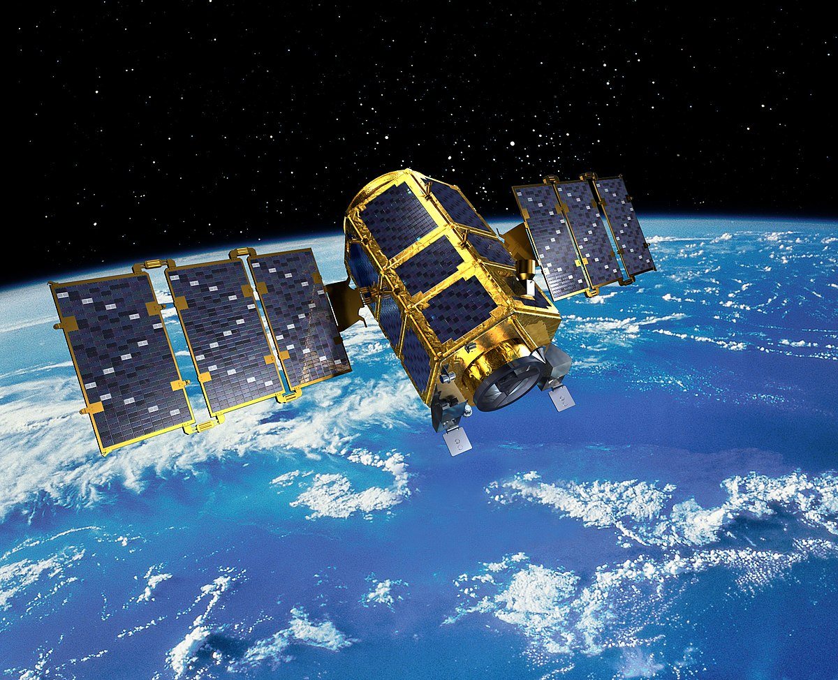 An illustration of the KOMPSAT-2 satellite, a gold body with blue solar panels, over ocean and cloud